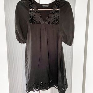 BCBG maxazria black top with floral cutout trim